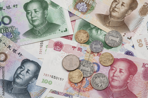 A collage of Chinese RMB bank notes and coins photo