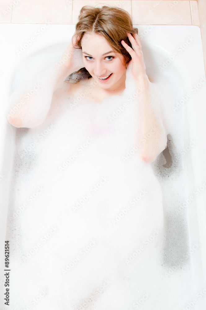 young woman having fun relaxing in bath young woman having fun relaxing in bath