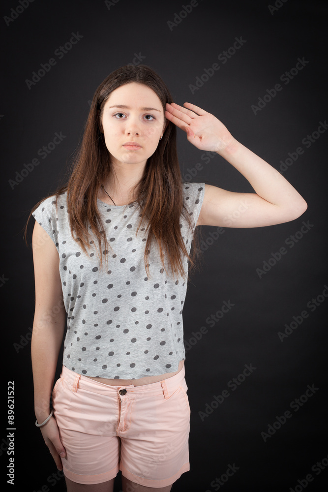 beautiful woman doing different expressions in different sets of clothes: at attention beautiful woman doing different expressions in different sets of clothes: at attention
