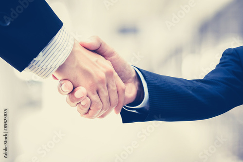 Handshake of businessmen - vintage tone