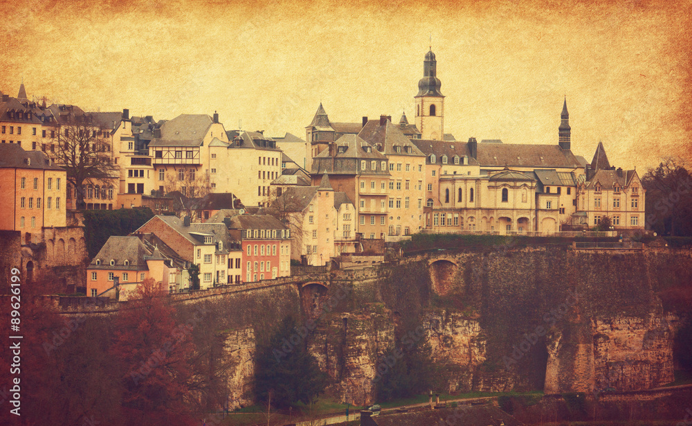 Skyline of Luxembourg City. Photo in retro style.  Added paper texture