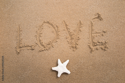 Love and sea star on the sand