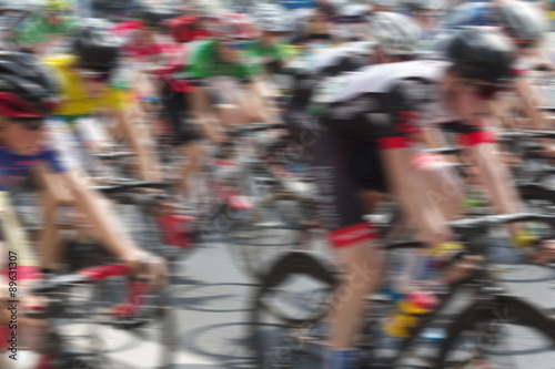 bicycle race , group of people on bikes - motion blur