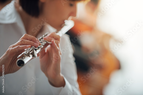 Professional flute player performing photo