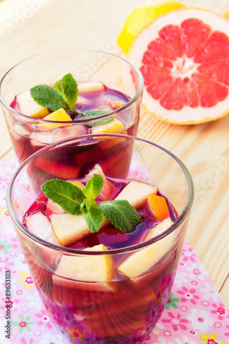 Refreshing summer drink with lots of different fruits