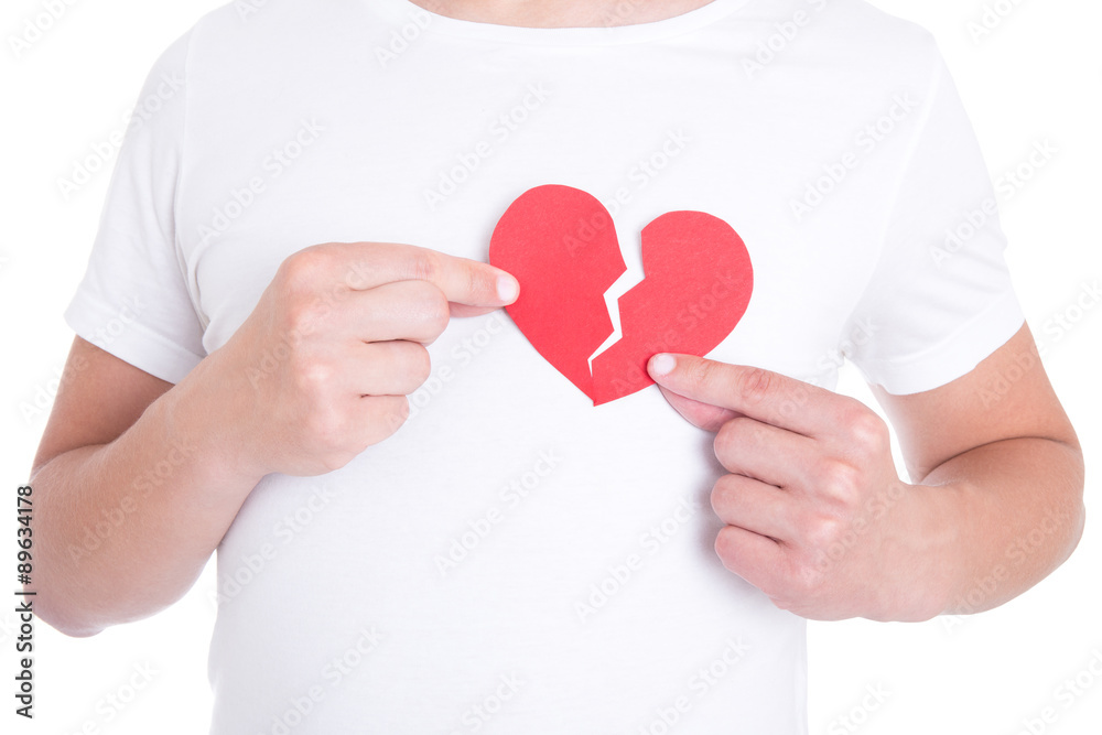 love concept - man holding two halfs of broken heart isolated on love concept - man holding two halfs of broken heart isolated on