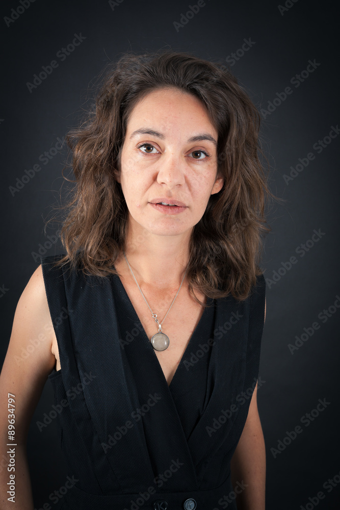 Beautiful woman doing different expressions in different sets of clothes: thinking