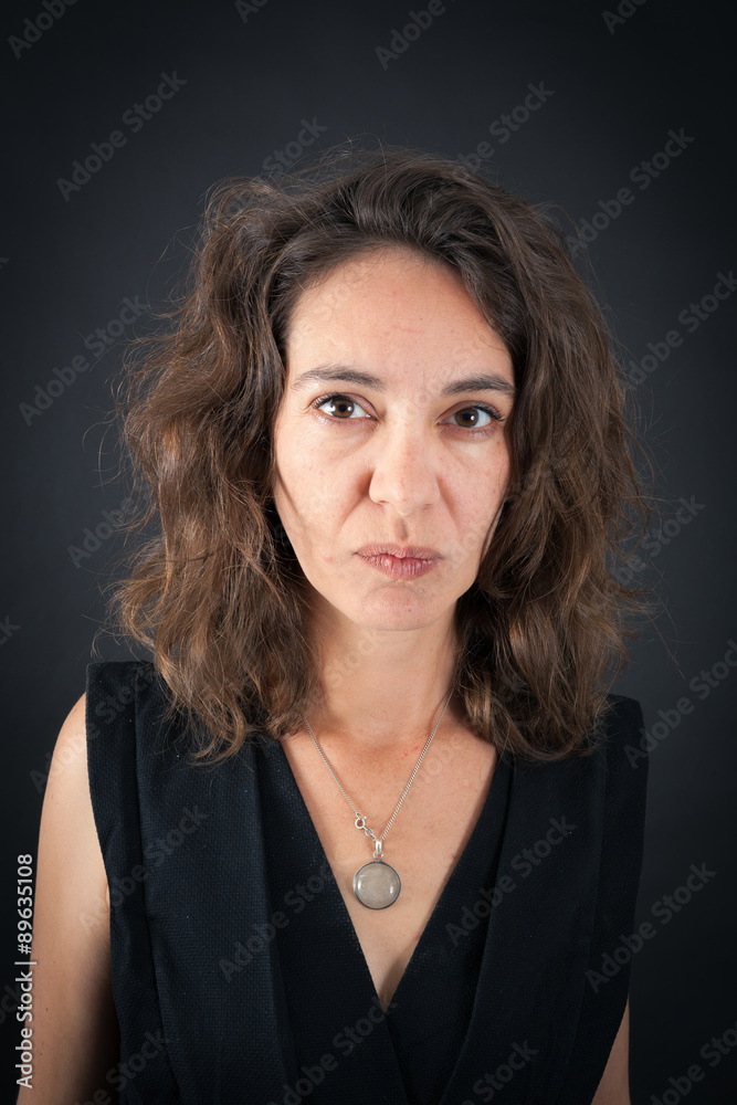 Beautiful woman doing different expressions in different sets of clothes: angry Beautiful woman doing different expressions in different sets of clothes: angry