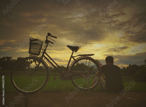 man rest near bicycle