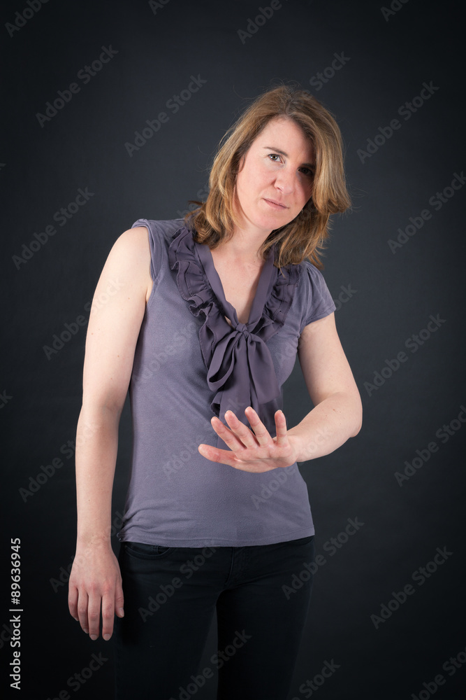 Beautiful woman doing different expressions in different sets of clothes: stop sign Beautiful woman doing different expressions in different sets of clothes: stop sign
