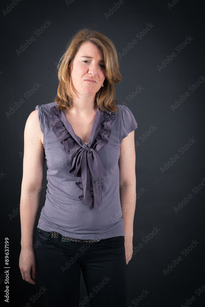 Beautiful woman doing different expressions in different sets of clothes: sad Beautiful woman doing different expressions in different sets of clothes: sad