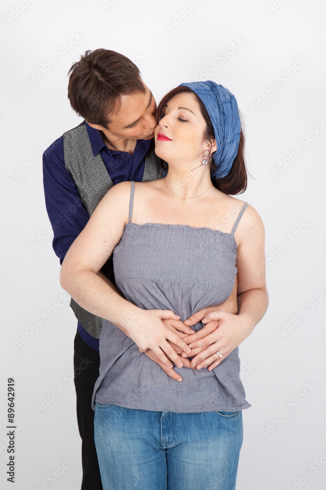 Beautiful couple doing different expressions in different sets of clothes: kiss Beautiful couple doing different expressions in different sets of clothes: kiss