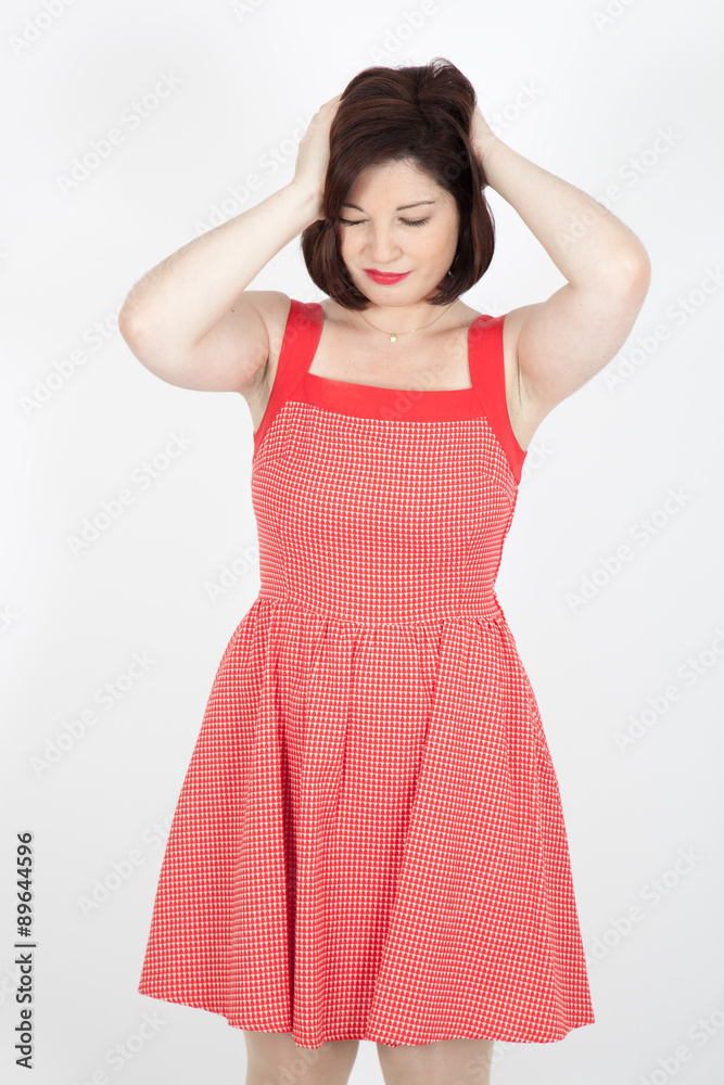 Beautiful woman doing different expressions in different sets of clothes: headache Beautiful woman doing different expressions in different sets of clothes: headache