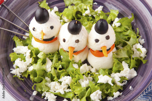 mozzarella cheese in the shape of a snowman