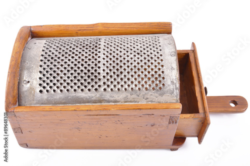 grated cheese in wooden antique handmade