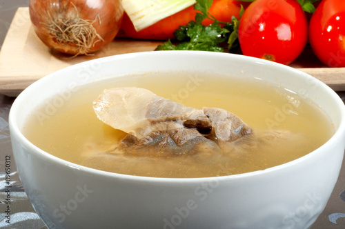 beef broth with a piece of veal