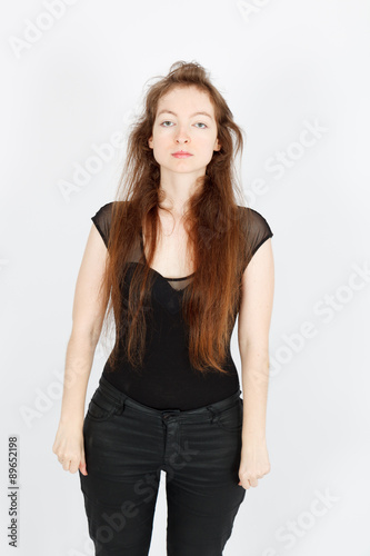 Beautiful businesswoman doing different expressions in different sets of clothes: angry