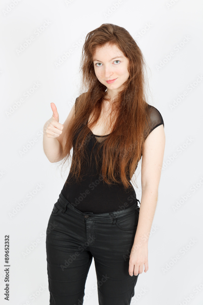 Beautiful businesswoman doing different expressions in different sets of clothes: thumbs up Beautiful businesswoman doing different expressions in different sets of clothes: thumbs up