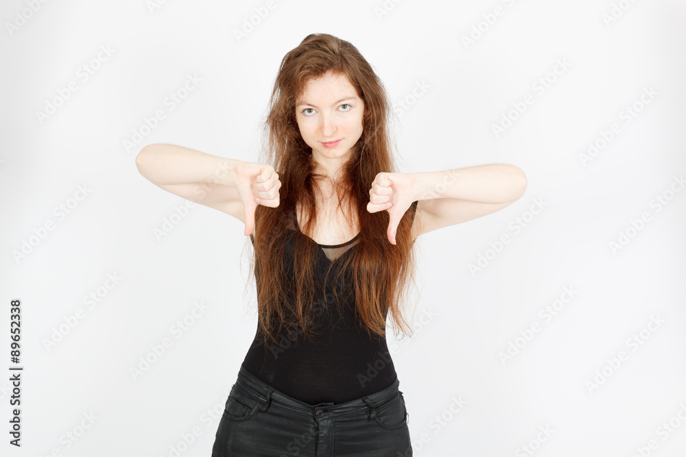 Beautiful businesswoman doing different expressions in different sets of clothes: thumbs down Beautiful businesswoman doing different expressions in different sets of clothes: thumbs down