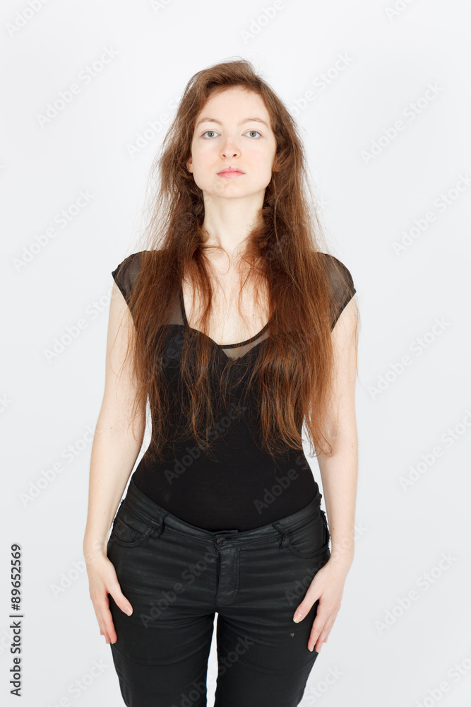 Beautiful businesswoman doing different expressions in different sets of clothes: at attention Beautiful businesswoman doing different expressions in different sets of clothes: at attention