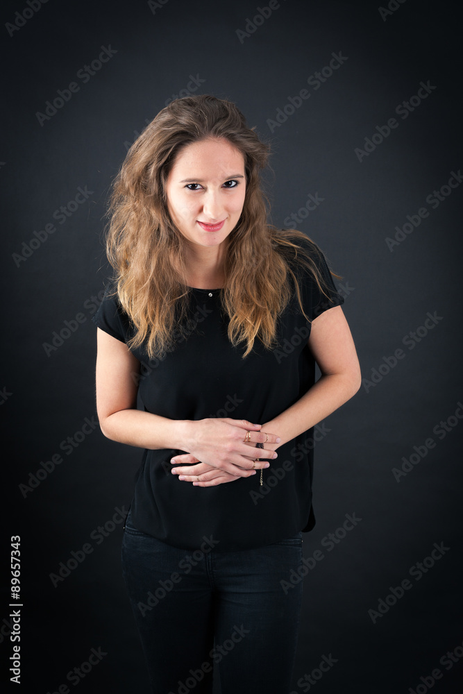 Beautiful woman doing different expressions in different sets of clothes: stomachache Beautiful woman doing different expressions in different sets of clothes: stomachache