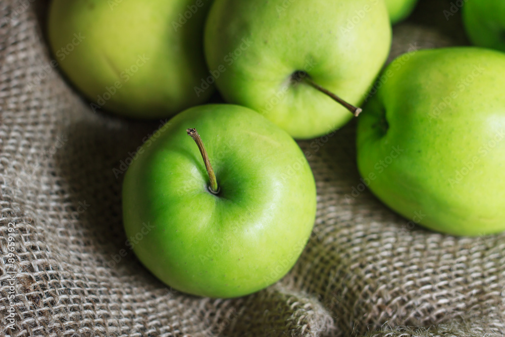 Green apples on brown suck Green apples on brown suck