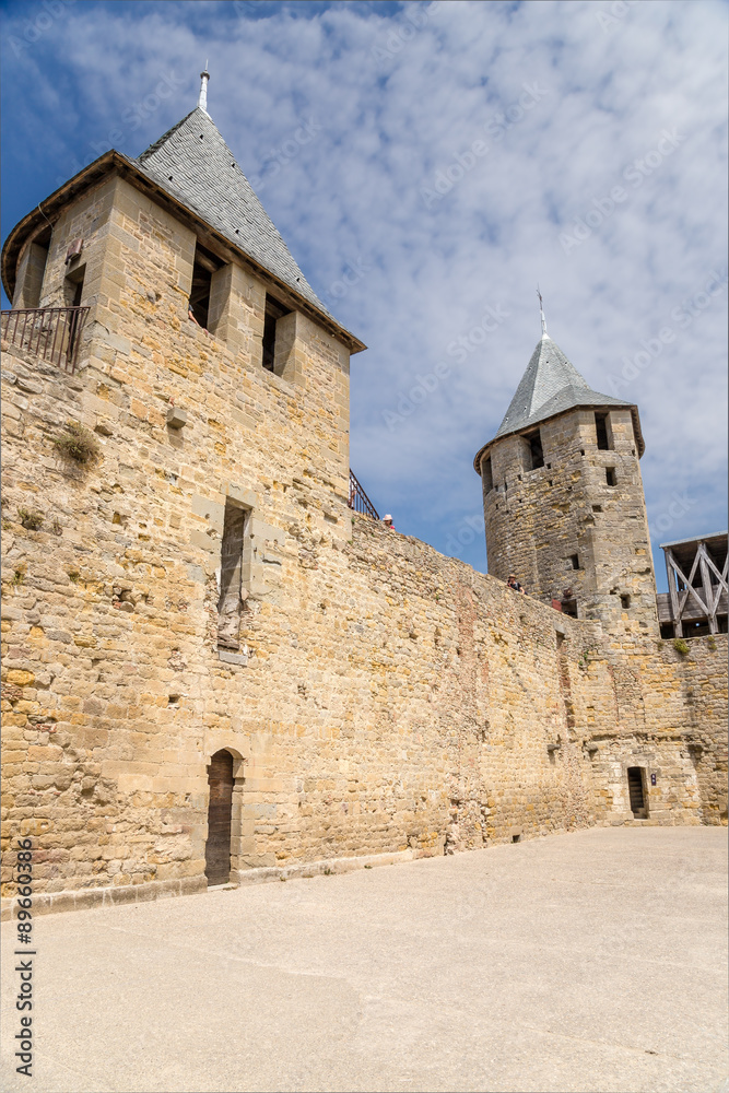Defensive wall and tower of the castle Comtal in the fortress of Carcassonne (France), 1130