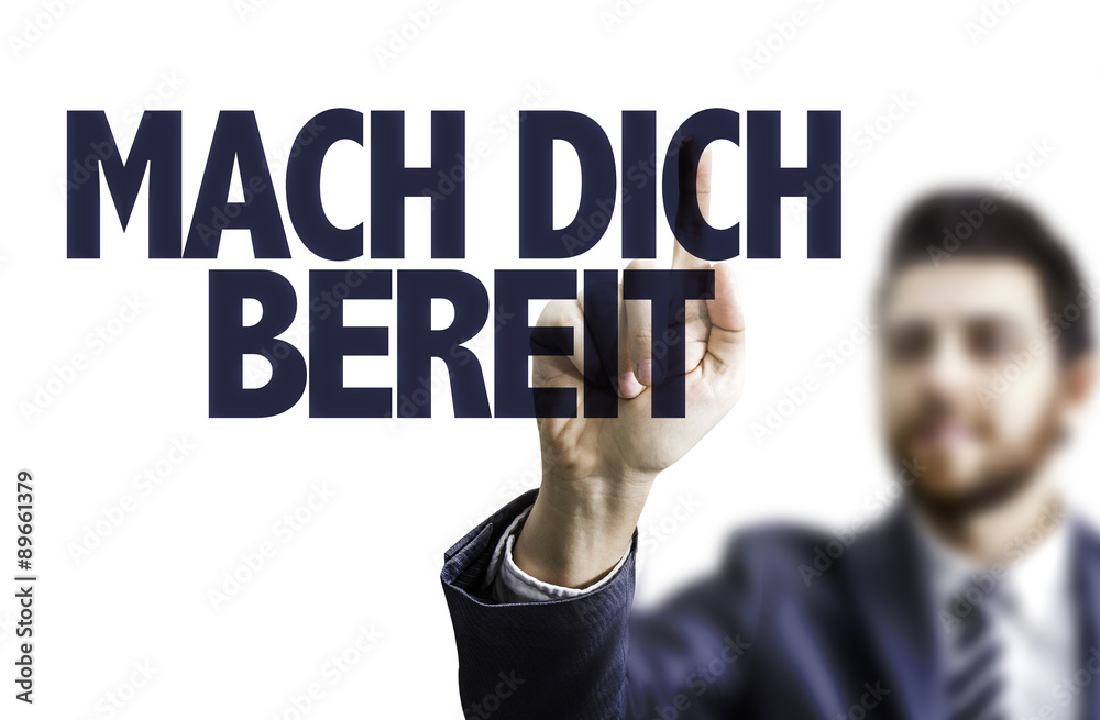 Business man pointing the text: Get Ready (in German) Business man pointing the text: Get Ready (in German)