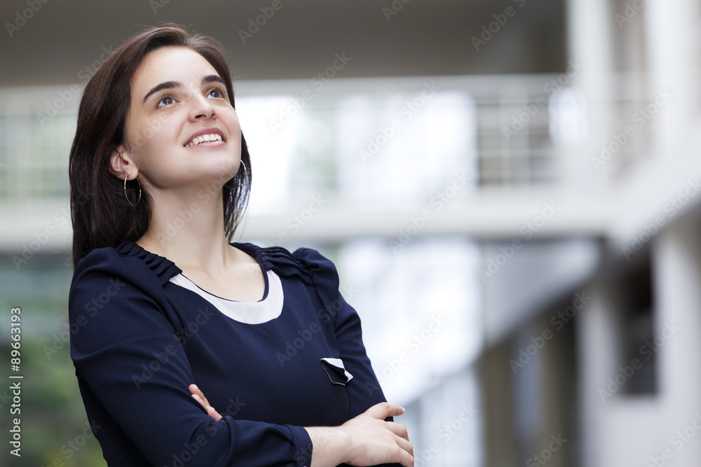 Portrait of a thoughtful business woman at modern office buildin Portrait of a thoughtful business woman at modern office buildin