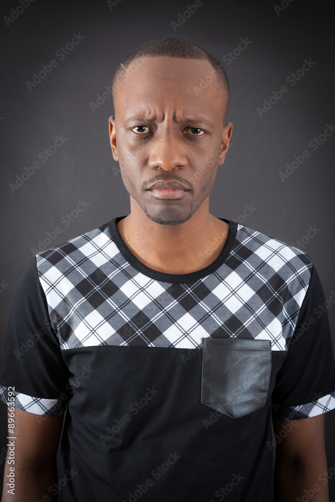 Fototapeta premium Handsome man doing different expressions in different sets of clothes: angry