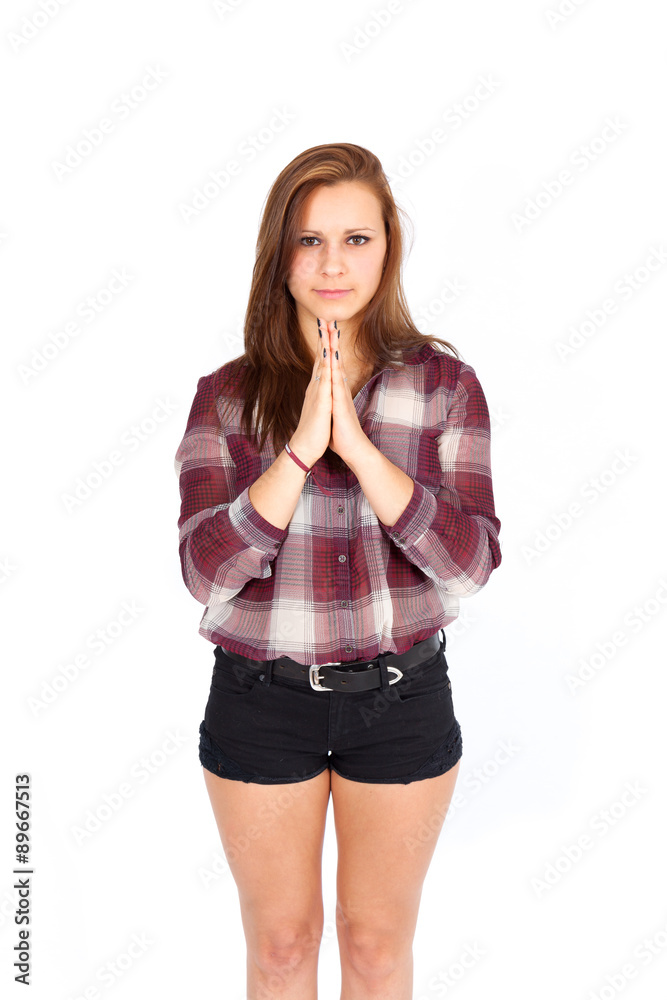 Fototapeta premium Beautiful woman doing different expressions in different sets of clothes: praying
