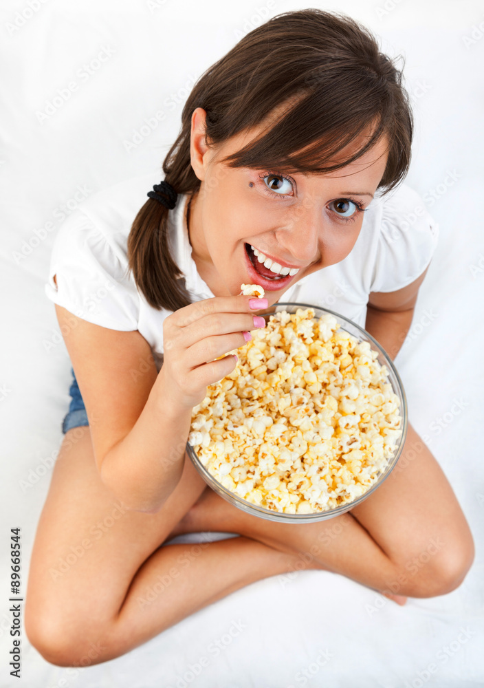 Young woman eating popcorn Young woman eating popcorn