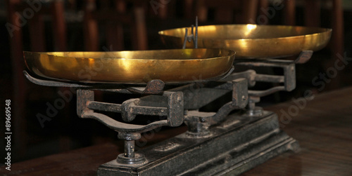 Antiquarian old scales with gold bowls. Balance.