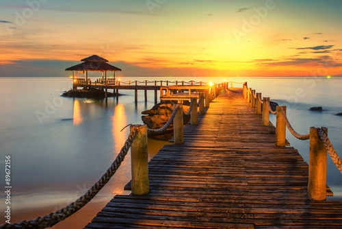 Summer, Travel, Vacation and Holiday concept - Wooden pier betwe photo