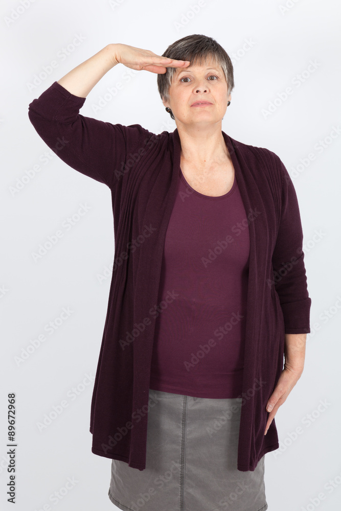 Beautiful woman doing different expressions in different sets of clothes: at attention Beautiful woman doing different expressions in different sets of clothes: at attention