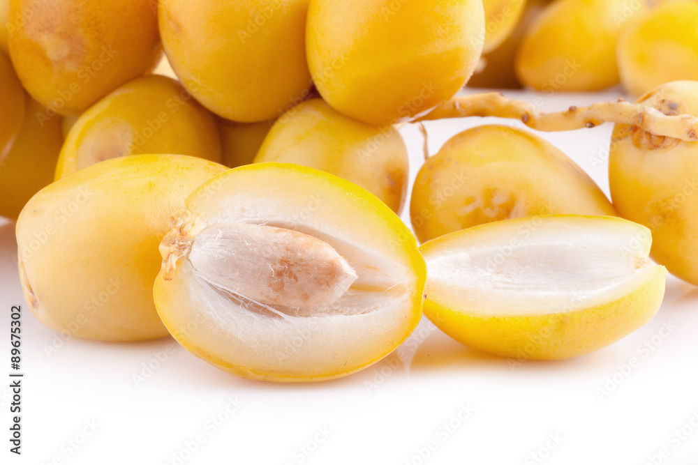 yellow raw dates isolated on white background