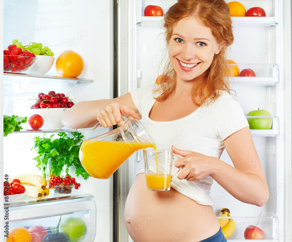 nutrition and diet during pregnancy. Pregnant woman with orange nutrition and diet during pregnancy. Pregnant woman with orange