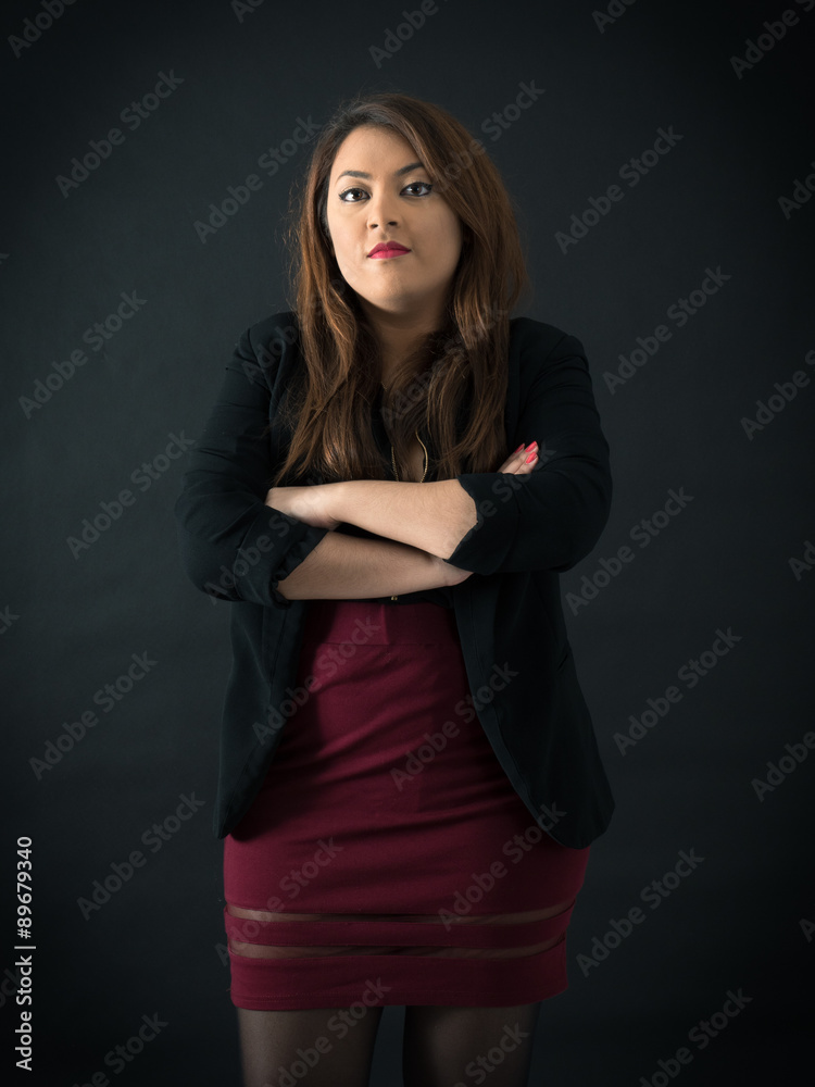 Beautiful woman doing different expressions in different sets of clothes: arms crossed Beautiful woman doing different expressions in different sets of clothes: arms crossed