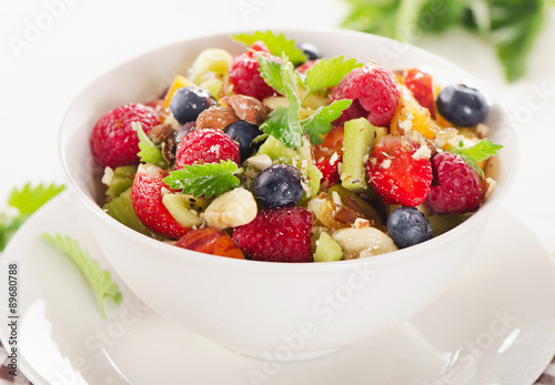 Salad with fruits and berries. Healthy breakfast.