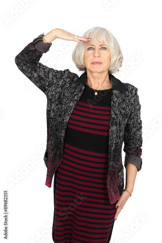 Beautiful woman doing different expressions in different sets of clothes: at attention
