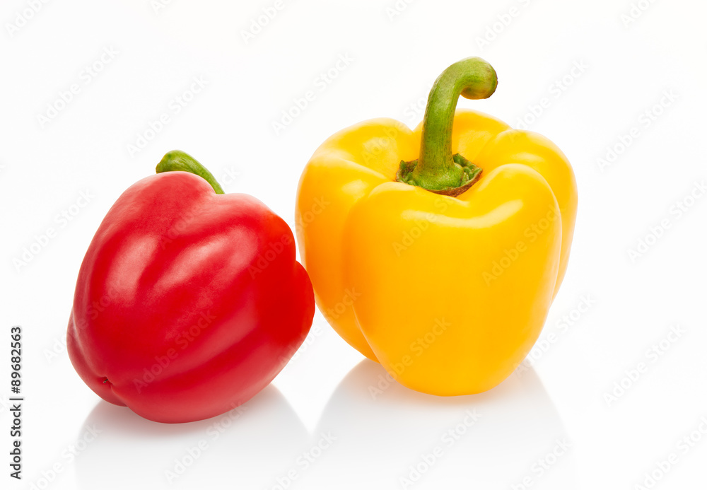 Yellow and red peppers isolated on white background. Clipping path included Yellow and red peppers isolated on white background. Clipping path included