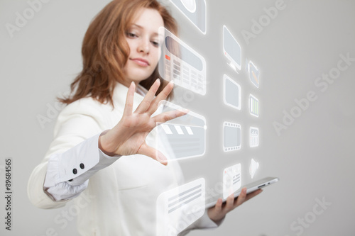 Woman pressing high tech type of modern multimedia buttons on a