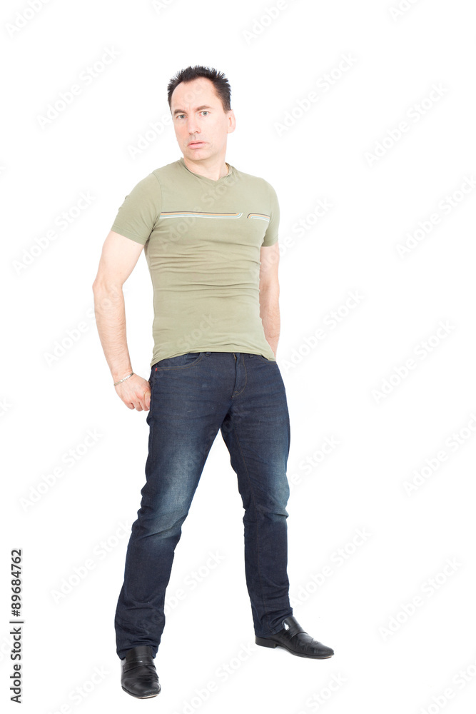 Handsome man doing different expressions in different sets of clothes: showing attention: hands in pockets Handsome man doing different expressions in different sets of clothes: showing attention: hands in pockets
