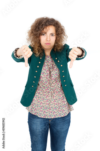 Beautiful Hispanic woman doing different expressions in different sets of clothes  thumbs down