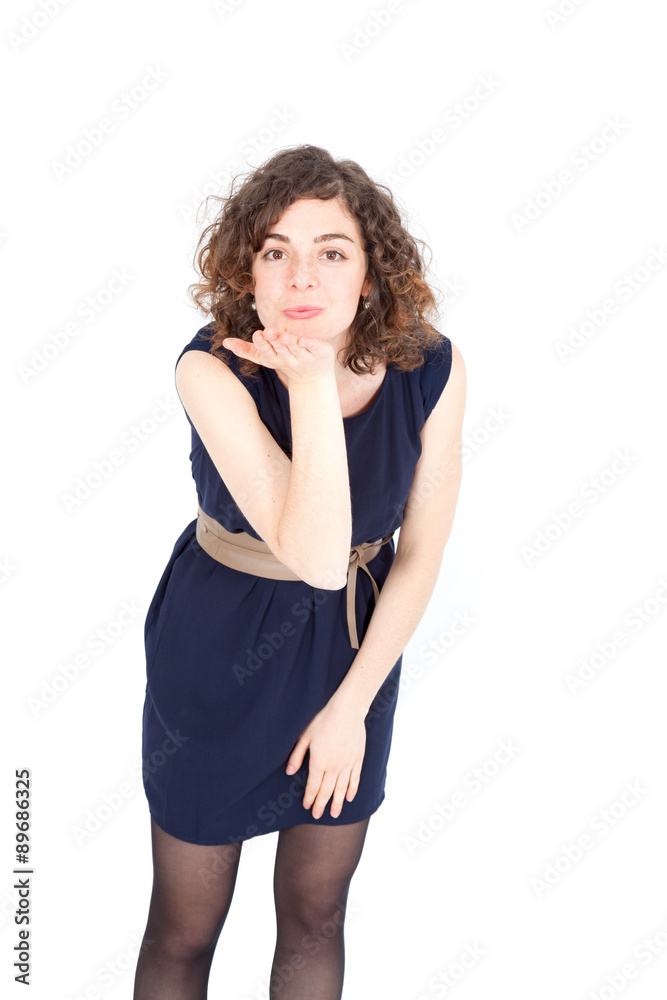 Fototapeta premium Beautiful Hispanic woman doing different expressions in different sets of clothes: kiss