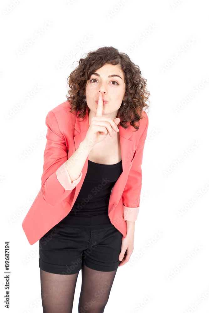 Beautiful Hispanic woman doing different expressions in different sets of clothes: be quiet Beautiful Hispanic woman doing different expressions in different sets of clothes: be quiet