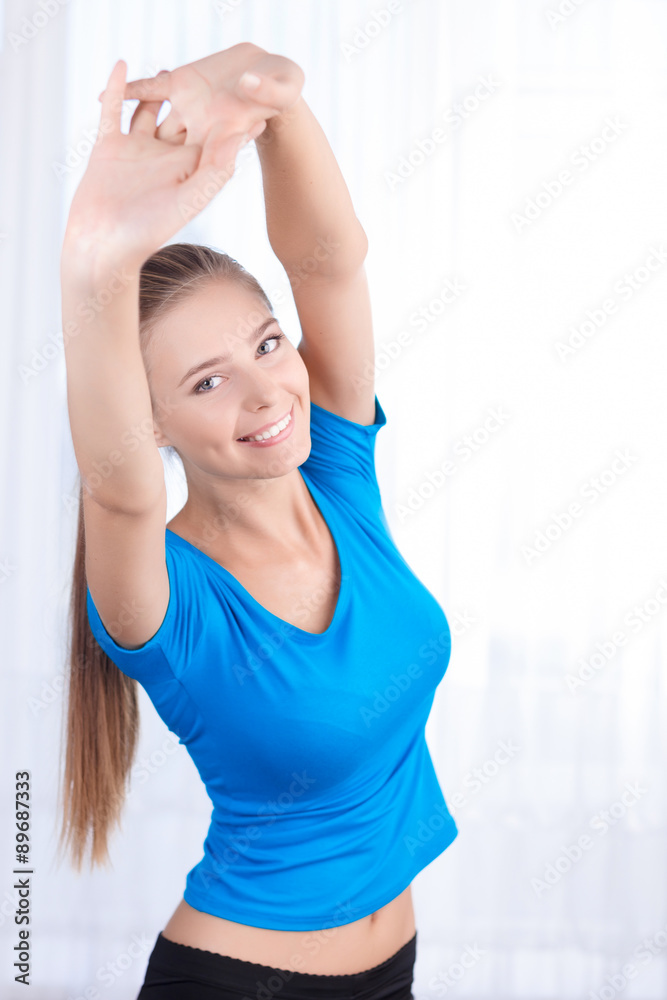 Happy girl doing exercises