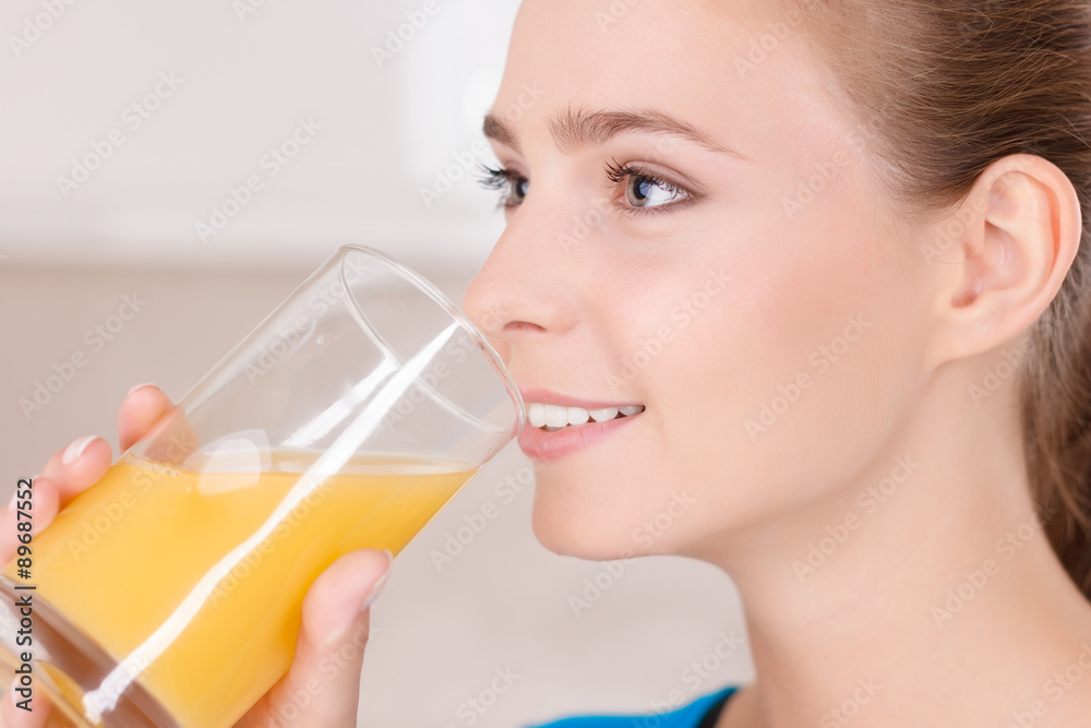 Smiling girl drinking juice Smiling girl drinking juice