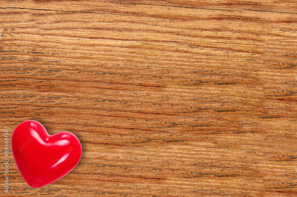 Red heart on wooden texture close-up Red heart on wooden texture close-up