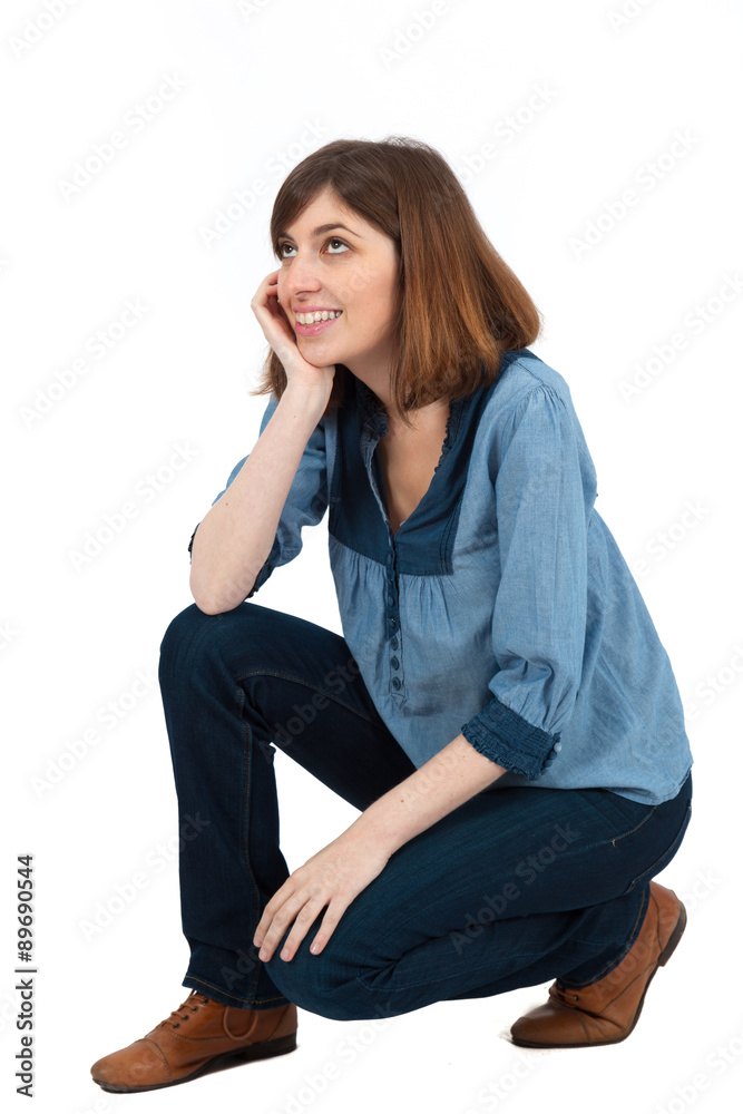 Beautiful woman doing different expressions in different sets of clothes: kneeling Beautiful woman doing different expressions in different sets of clothes: kneeling
